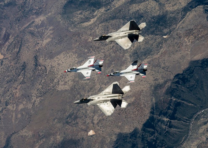 Illustration for article titled These Photos Of Thunderbirds F-16s Flying With F-22 Raptors Is A Whole Lot Of America